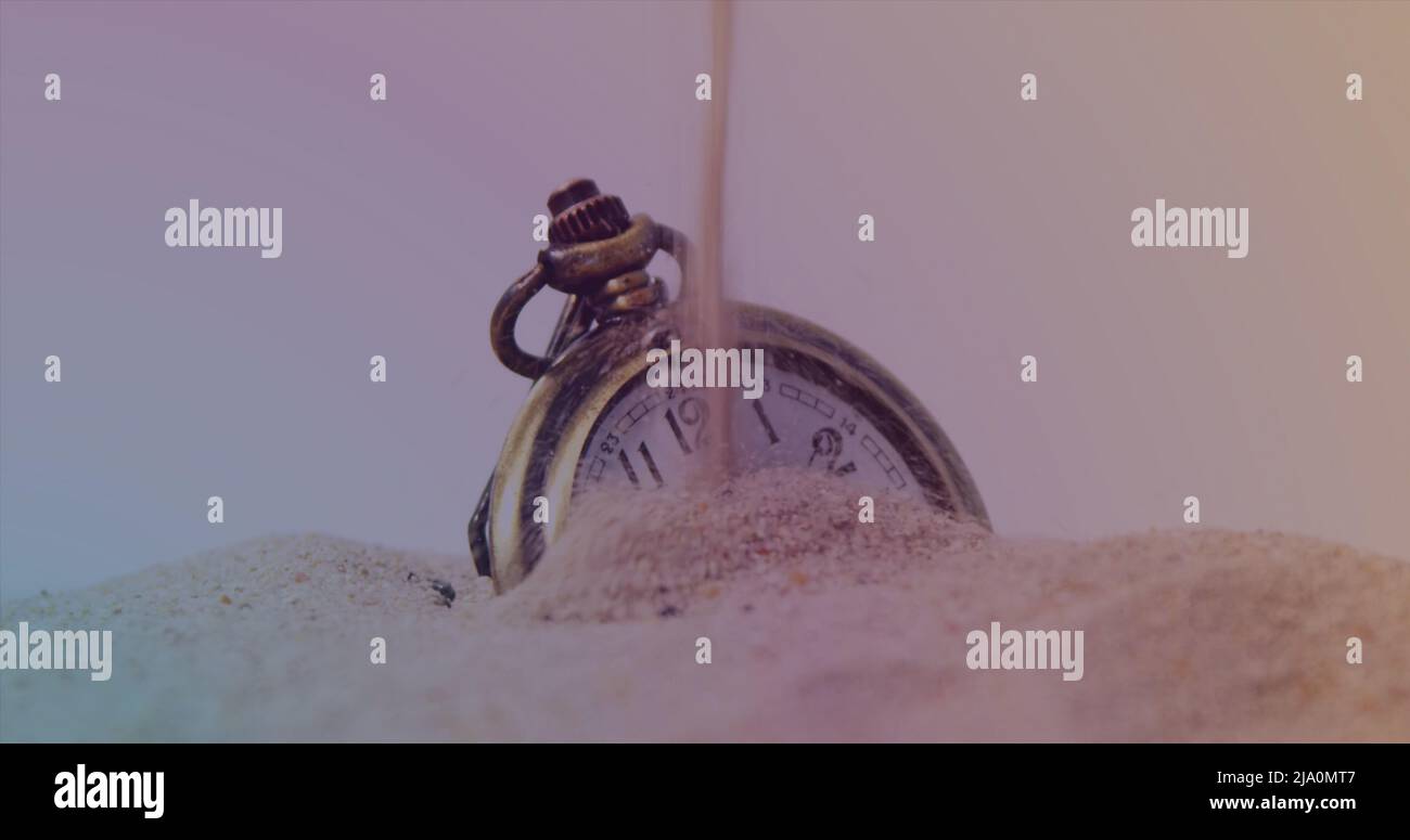 Image of clock over sand and timer Stock Photo