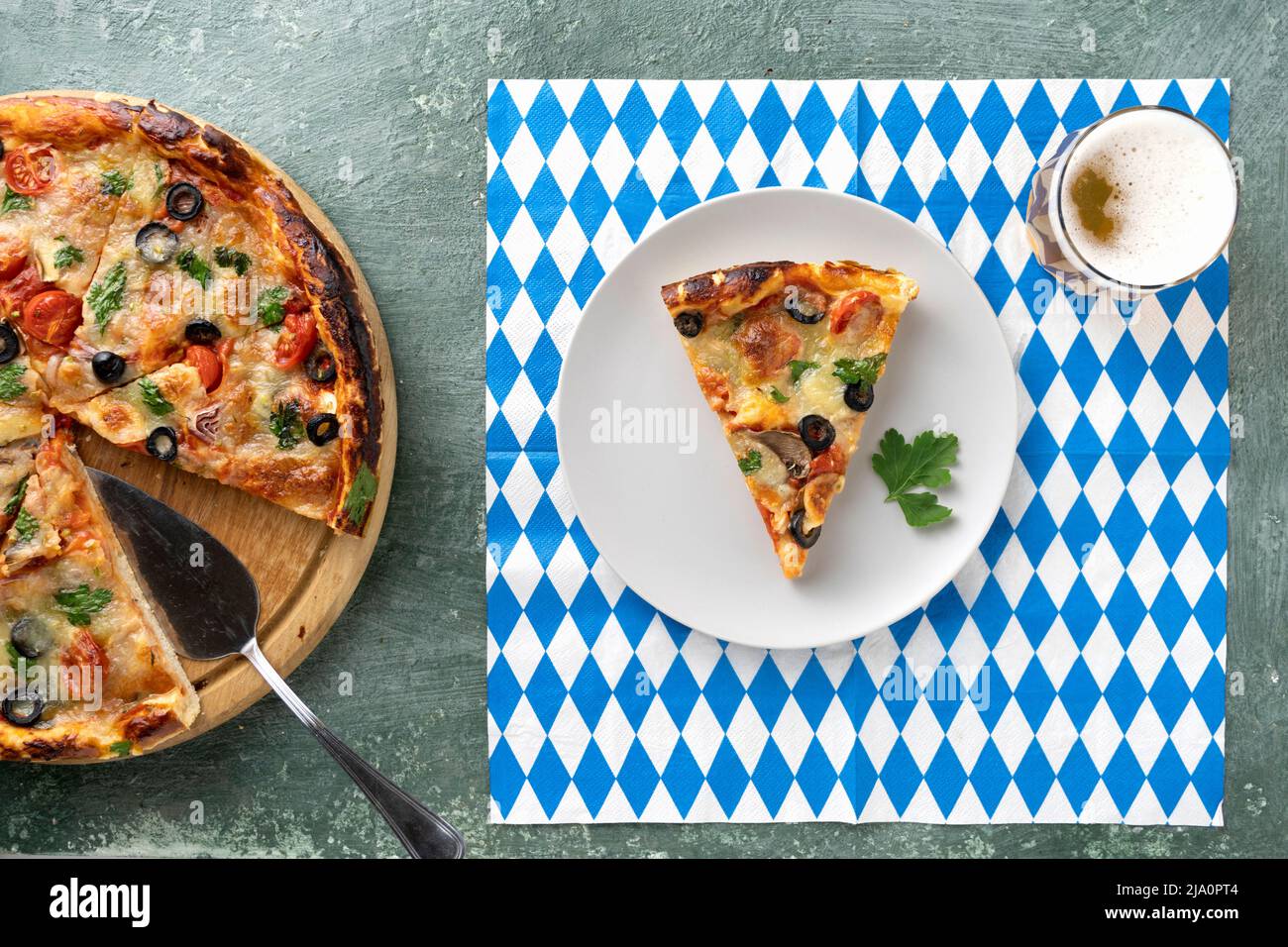 Pizza and beer on an Oktoberfest napkin, the annual German beer and