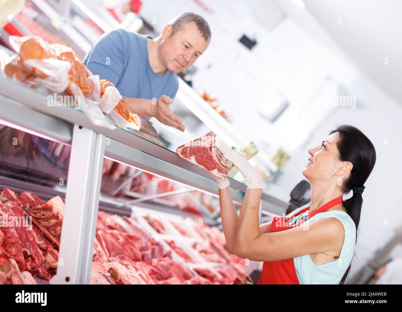 Male butcher female customer hi-res stock photography and images - Alamy