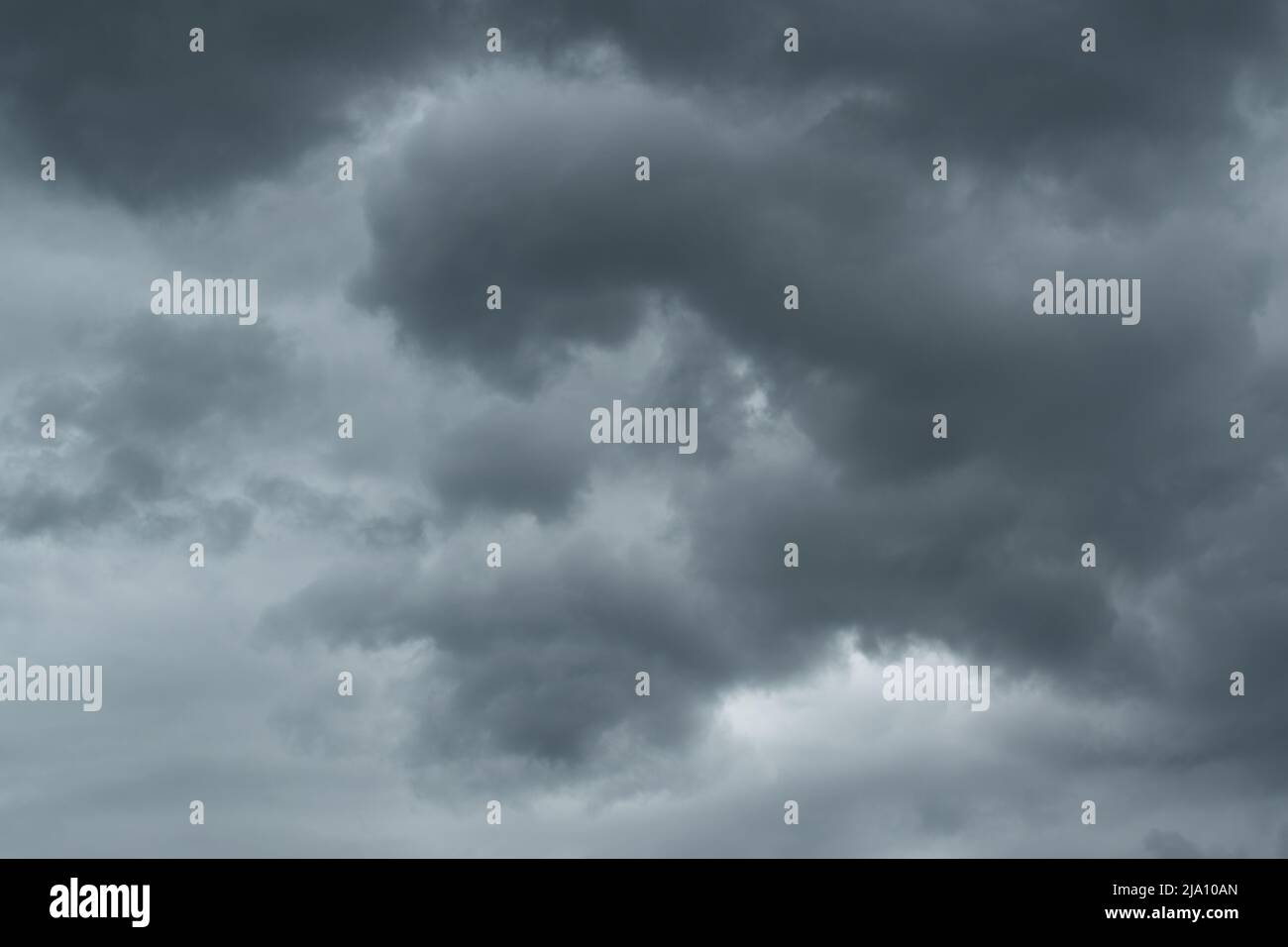 Abstract stormy weather clouds, dark gray ominous clouds, swirl movement in atmosphere Stock Photo