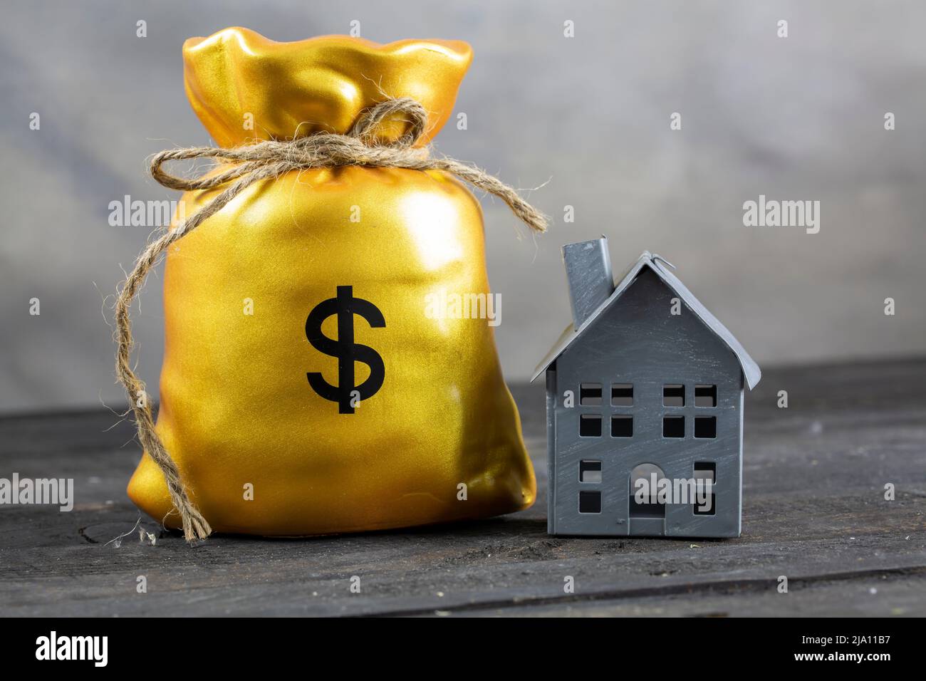 Money bag and House Buying a House concept Stock Photo