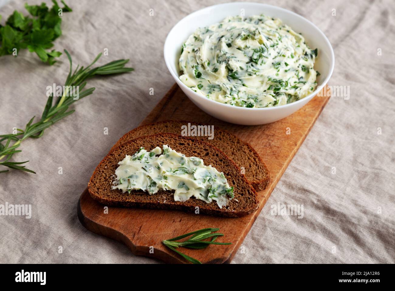 Homemade Herb Butter with Rosemary and Parsley, side view Stock Photo