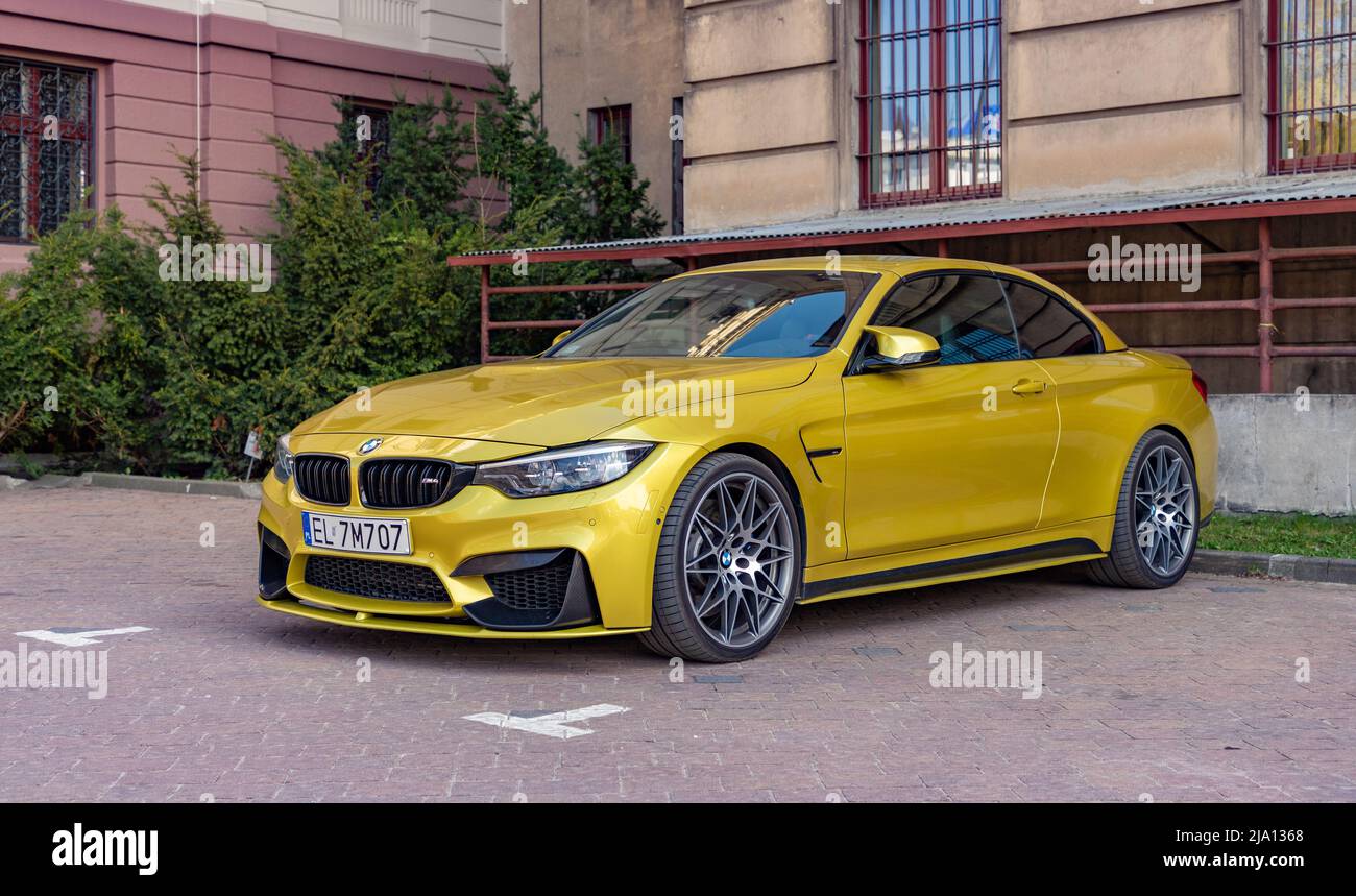 A picture of a golden BMW M4 Coupé. Stock Photo