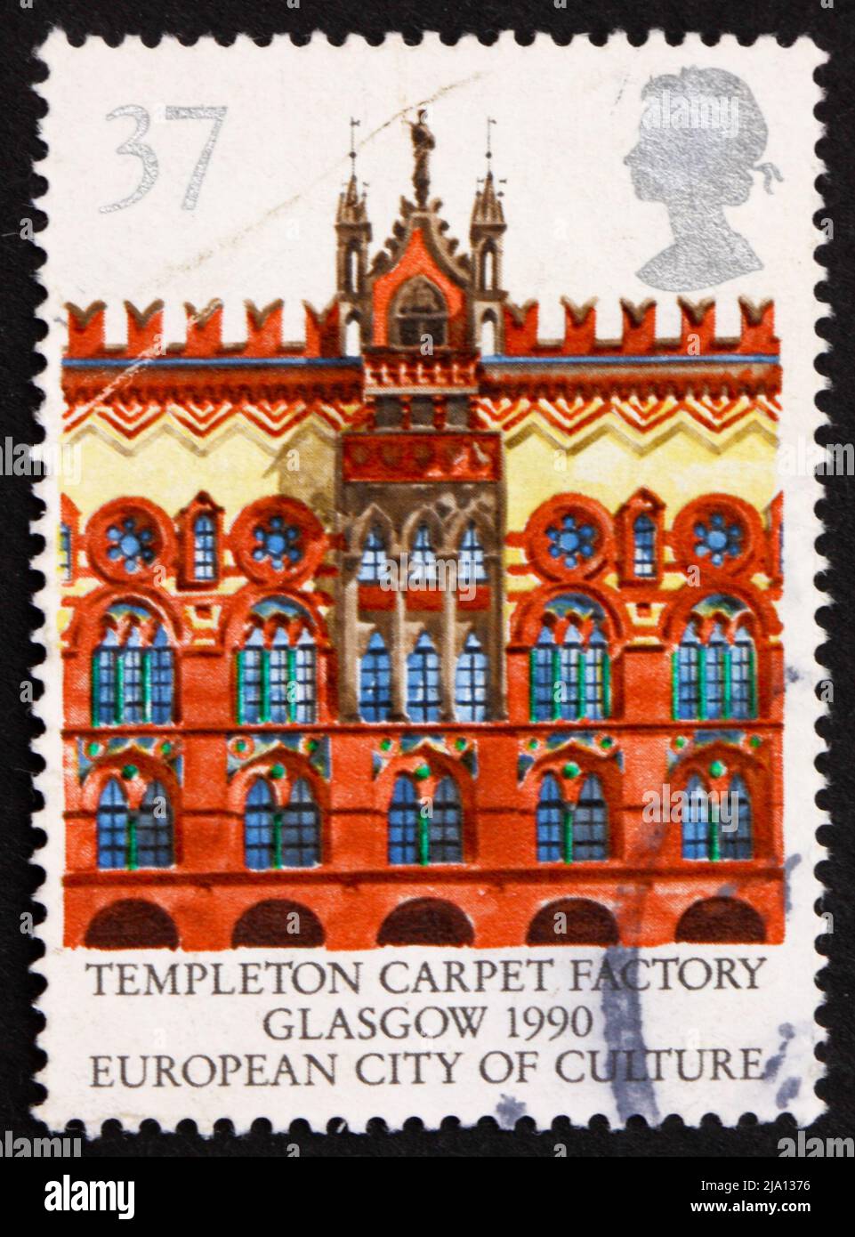 GREAT BRITAIN - CIRCA 1990: a stamp printed in the Great Britain shows Building of Templeton Carpet Factory in Glasgow, circa 1990 Stock Photo