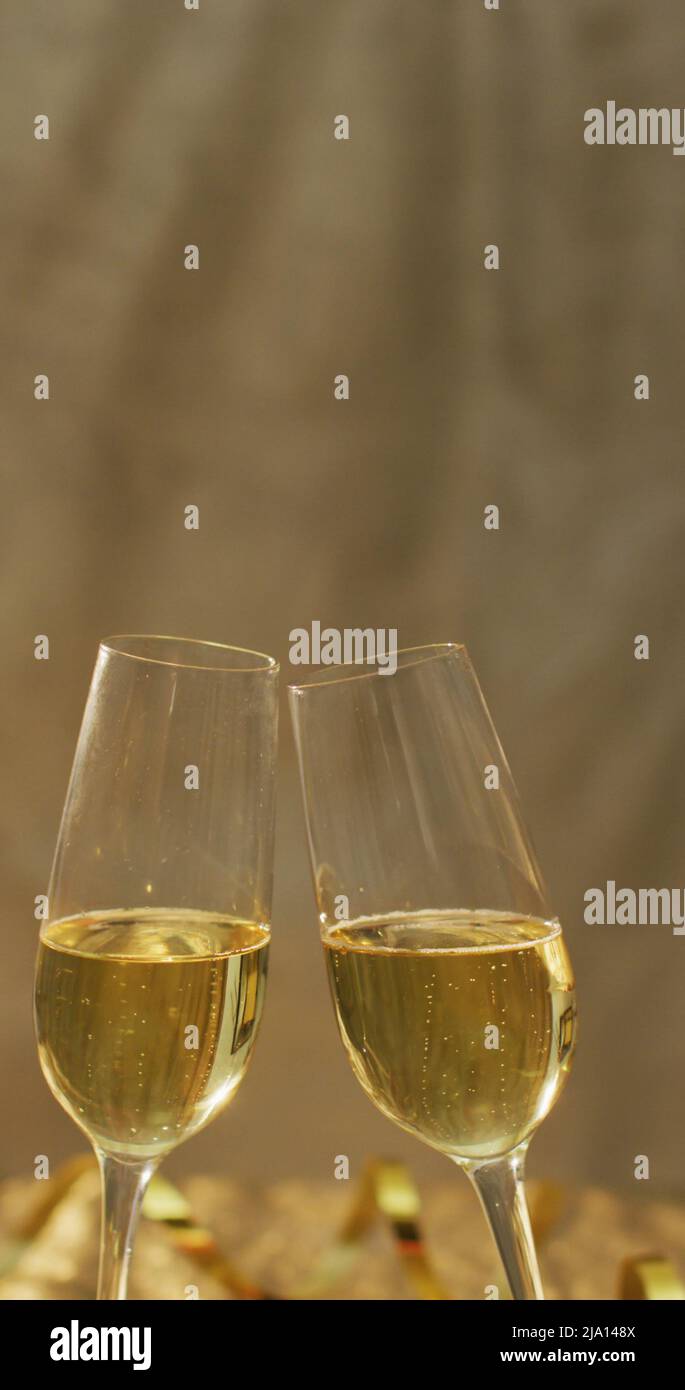 Vertical image of two glasses of champagne making a toast Stock Photo