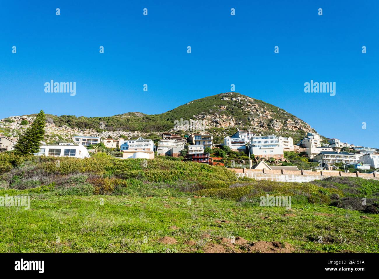 houses or villas on a hillside or mountain at a coastal town in Cape Town, South Africa Stock Photo