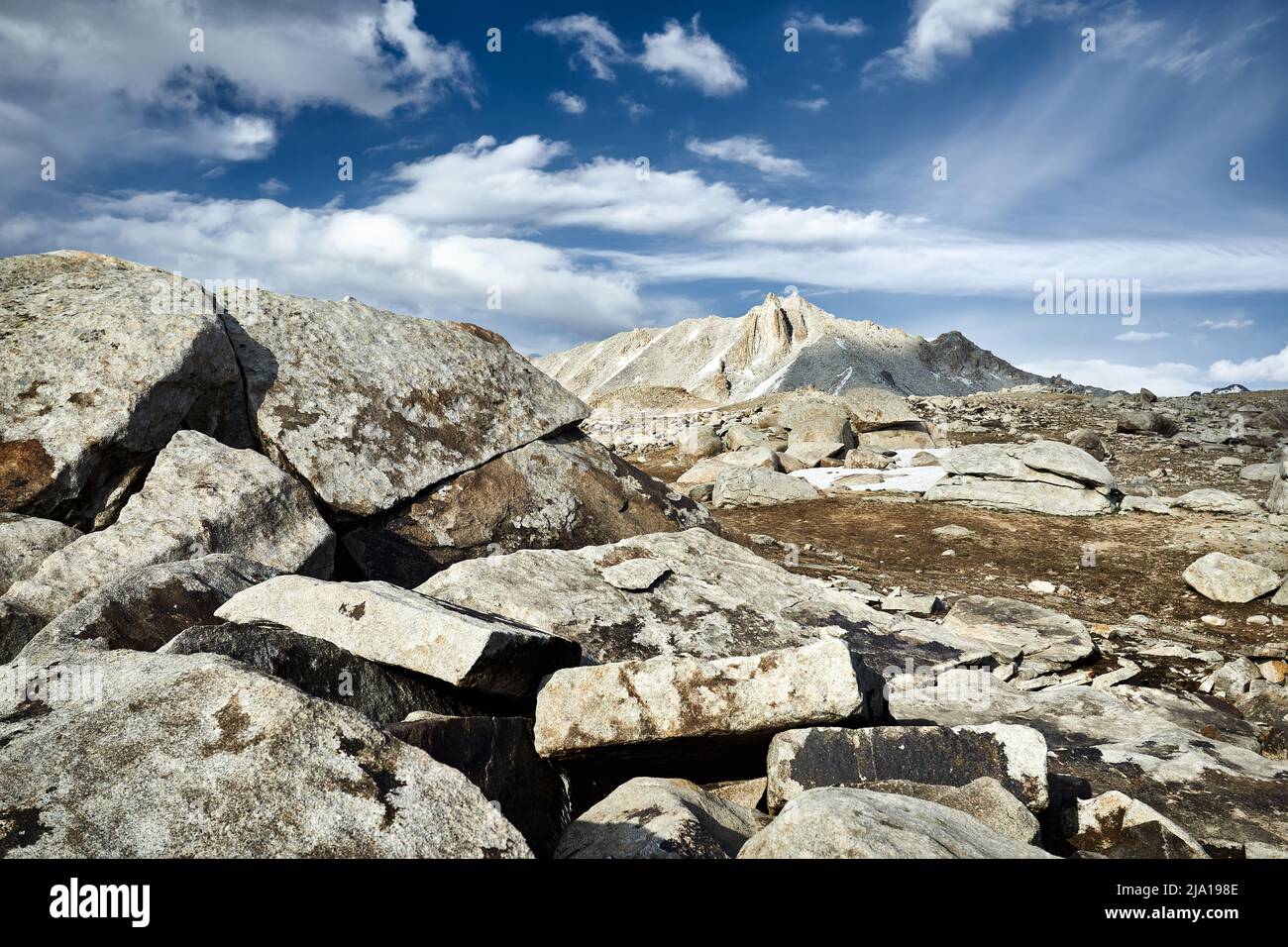 Beautiful scenery of the big rocky mountain at cloudy blue in Tien Shan, Kazakhstan. Stock Photo