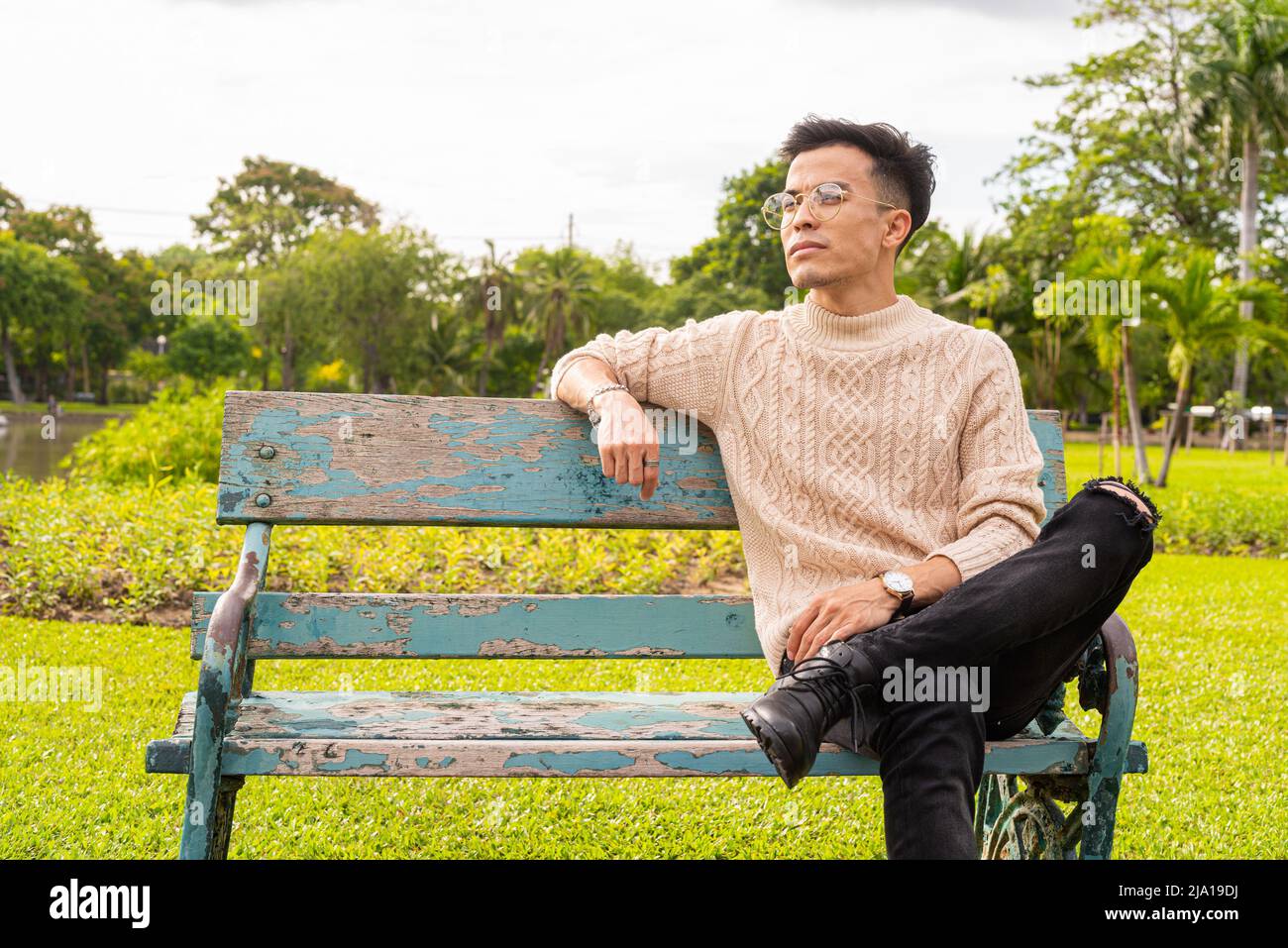 Happy young man sit hi-res stock photography and images - Alamy