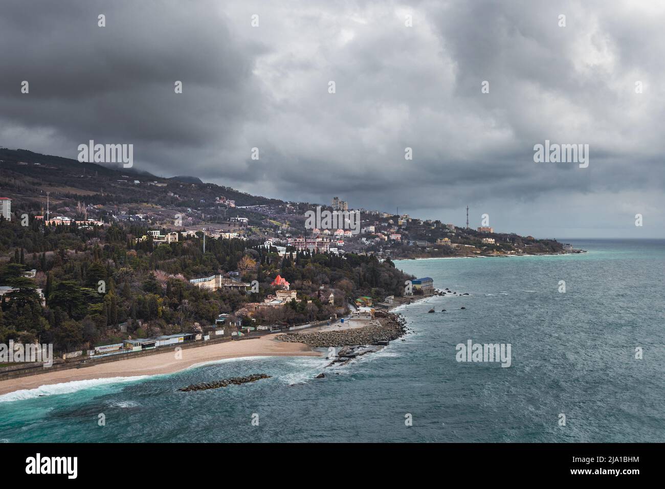 View from a rock Diva at city beach on cloudy weather dayin spring. Simeiz, Crimea Stock Photo