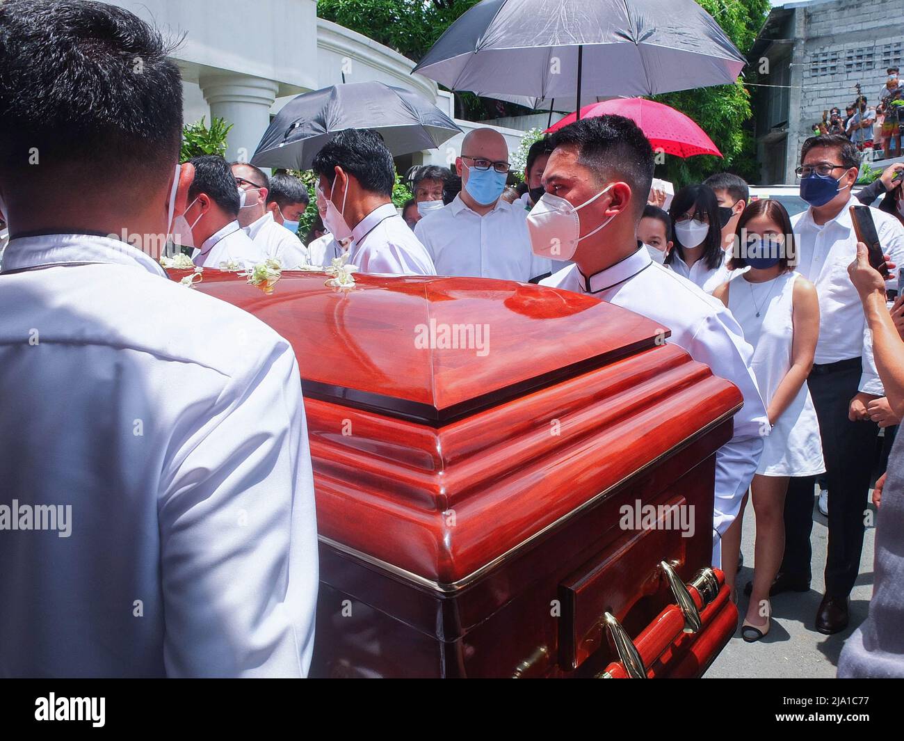 Manila, Philippines. 26th May, 2022. Funeral parlor workers carry the casket of the late movie