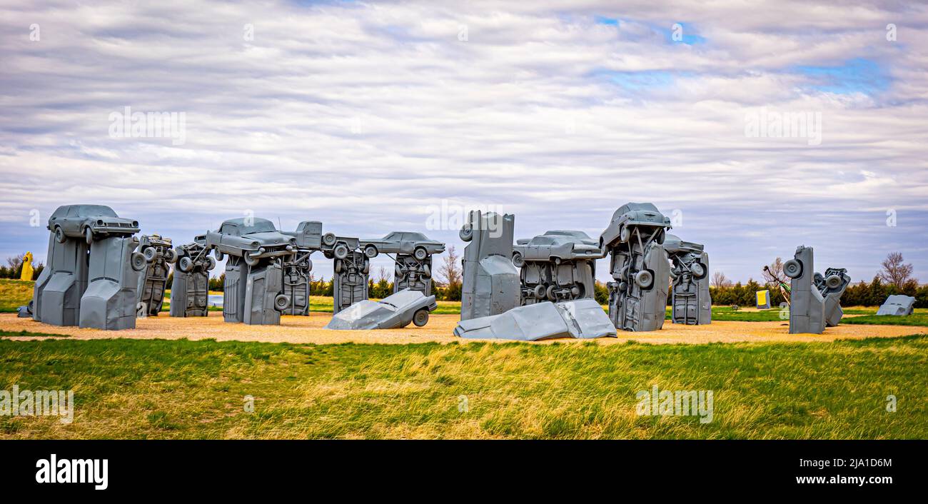 Carhenge is a  replica of Stonehenge in England that is created from old automobiles by Jim Reindersin in Alliance Nebraska USA Stock Photo