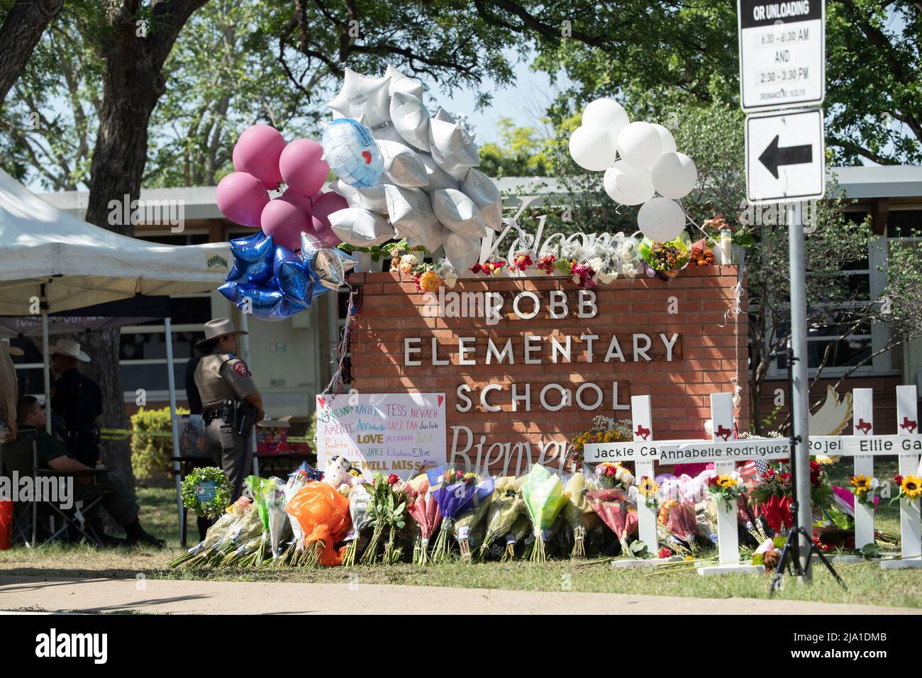 Uvalde, TX, USA. 26th May, 2022. Crosses with the name of each victim line the sidewalk in front of Robb Elementary School in south Uvalde as people continue to bring flowers to the scene of Tuesday's mass shooting that left 21 dead, including 19 children. (Credit Image: © Bob Daemmrich/ZUMA Press Wire) Stock Photo