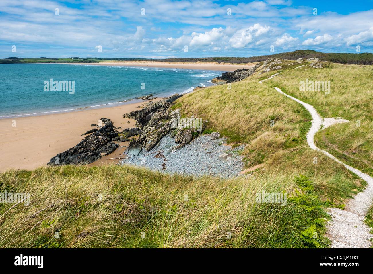 Newborough in the south west of Anglesey is a coastal nature reserve of sand dunes and beach Stock Photo