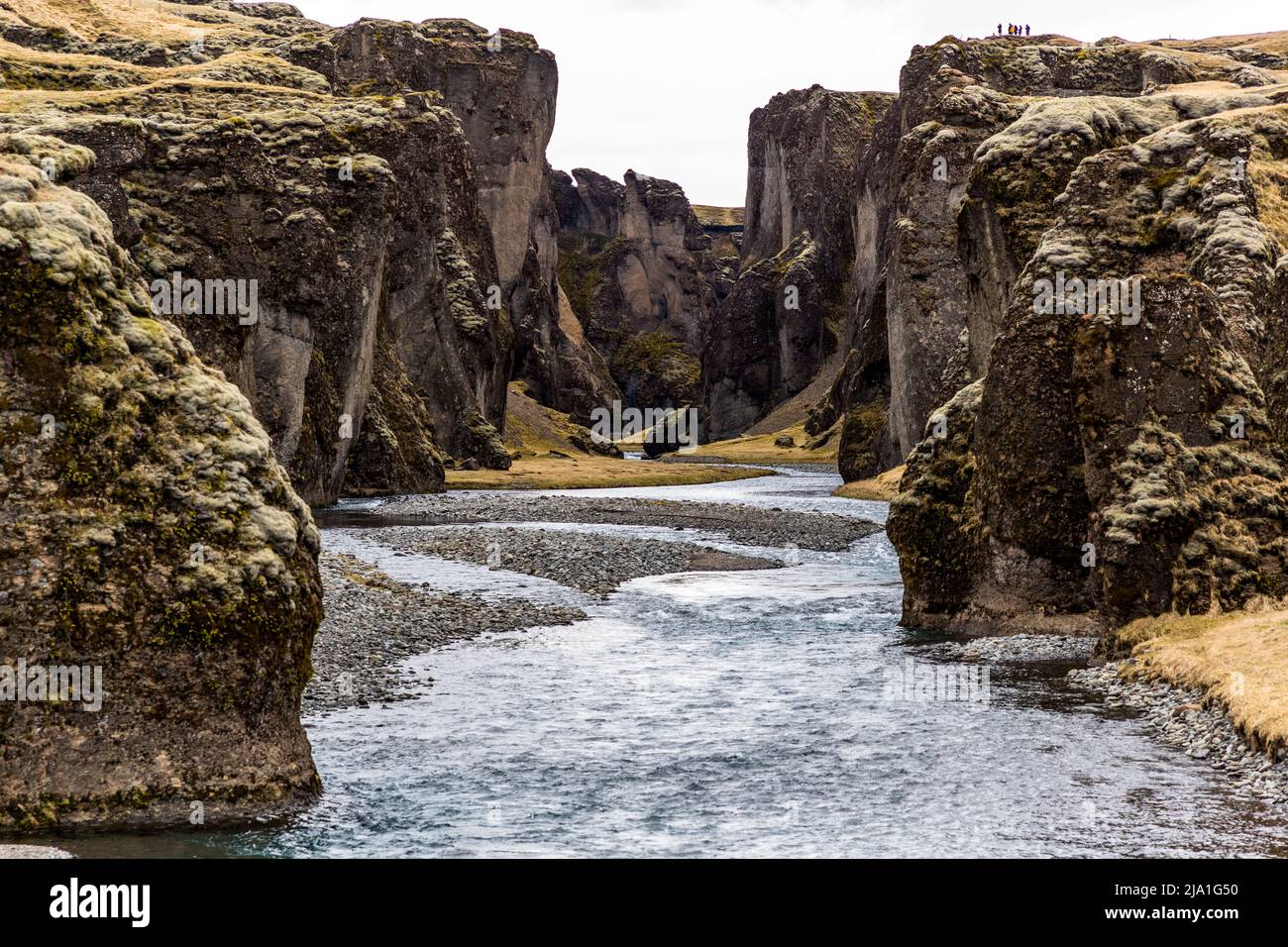 The canyon of Fjaðrárgljúfur is located near Kirkjubæjarklaustur, in Iceland. The canyon was formed by the river Fjaðrá. The river originates in the highlands and has dug up to 100 meters deep into the palagonite rock. Stock Photo