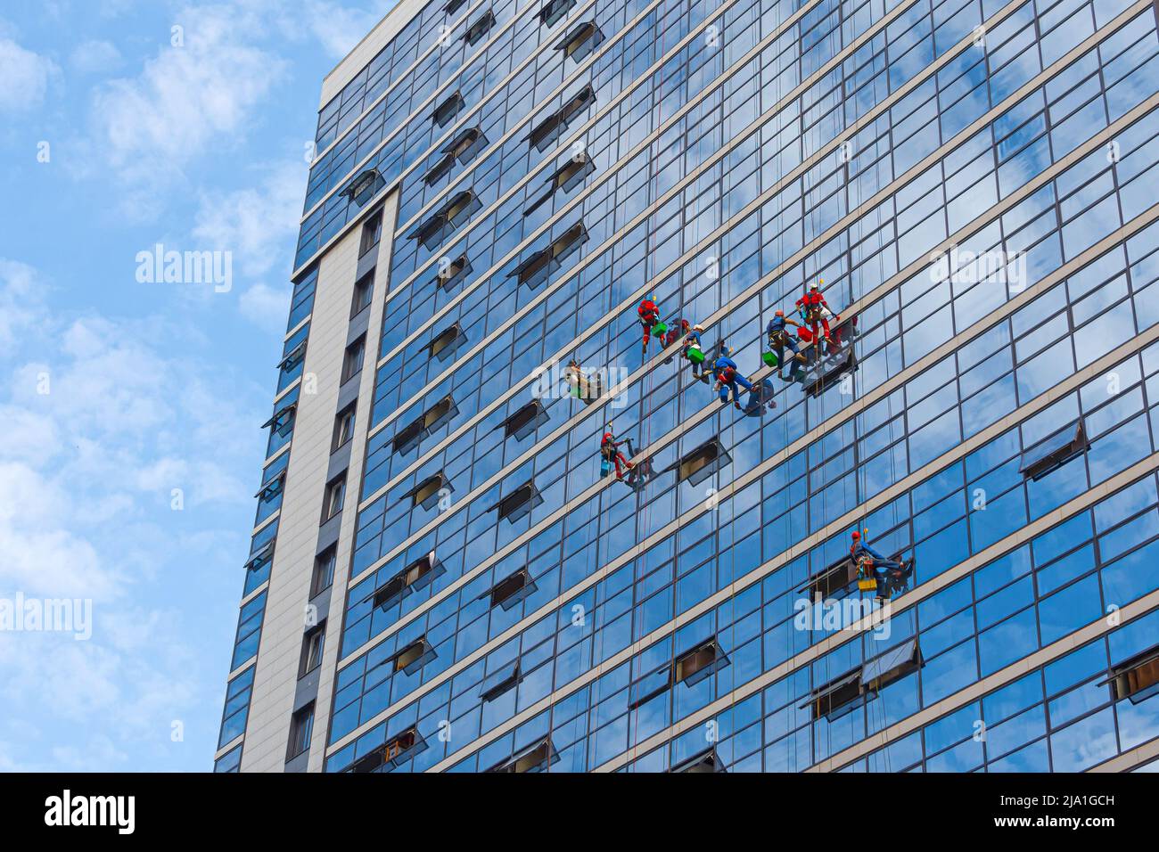 Premium Photo  Window cleaning in high-rise buildings, houses with a brush.  window cleaning brush. large window in a multi-storey building, cleaning  service. dust removal and glass washing.