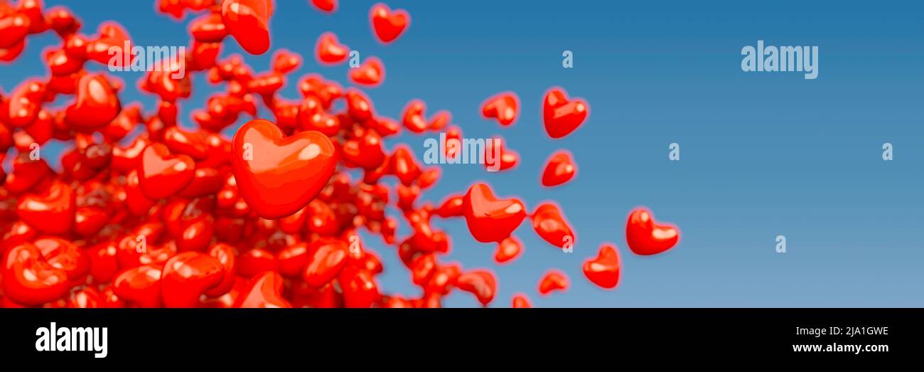 Many flying red love hearts, Love is in the air Stock Photo