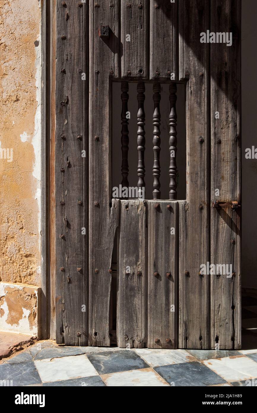 A weathered wooden door opening into the El Morro Fort, Old San Juan, Puerto Rico Stock Photo