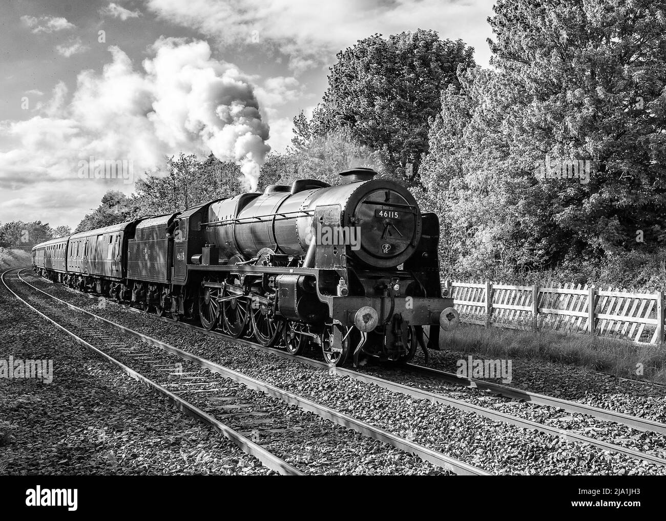 Scots Guardsman 46115 passing through Long Preston on 26th May 2022. Settle & Carlisle line heritage steam train tour returning to York. Stock Photo