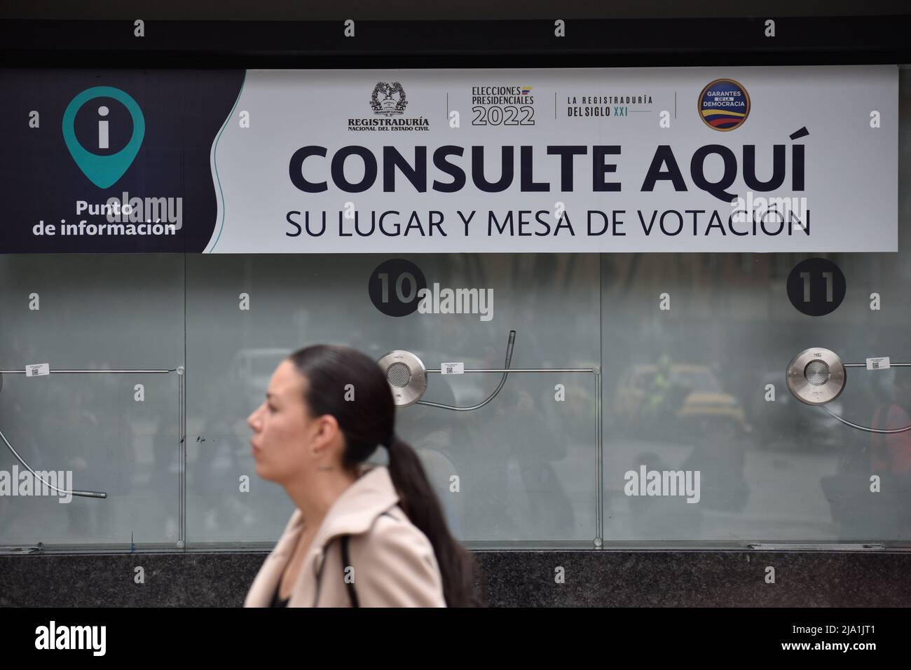 A person stands in front of a information window set for the Presidential Elections in Bogota, Colombia May 26, 2022. Presidential elections will take place on May 29. Photo by: Camilo Erasso/Long Visual Press Stock Photo