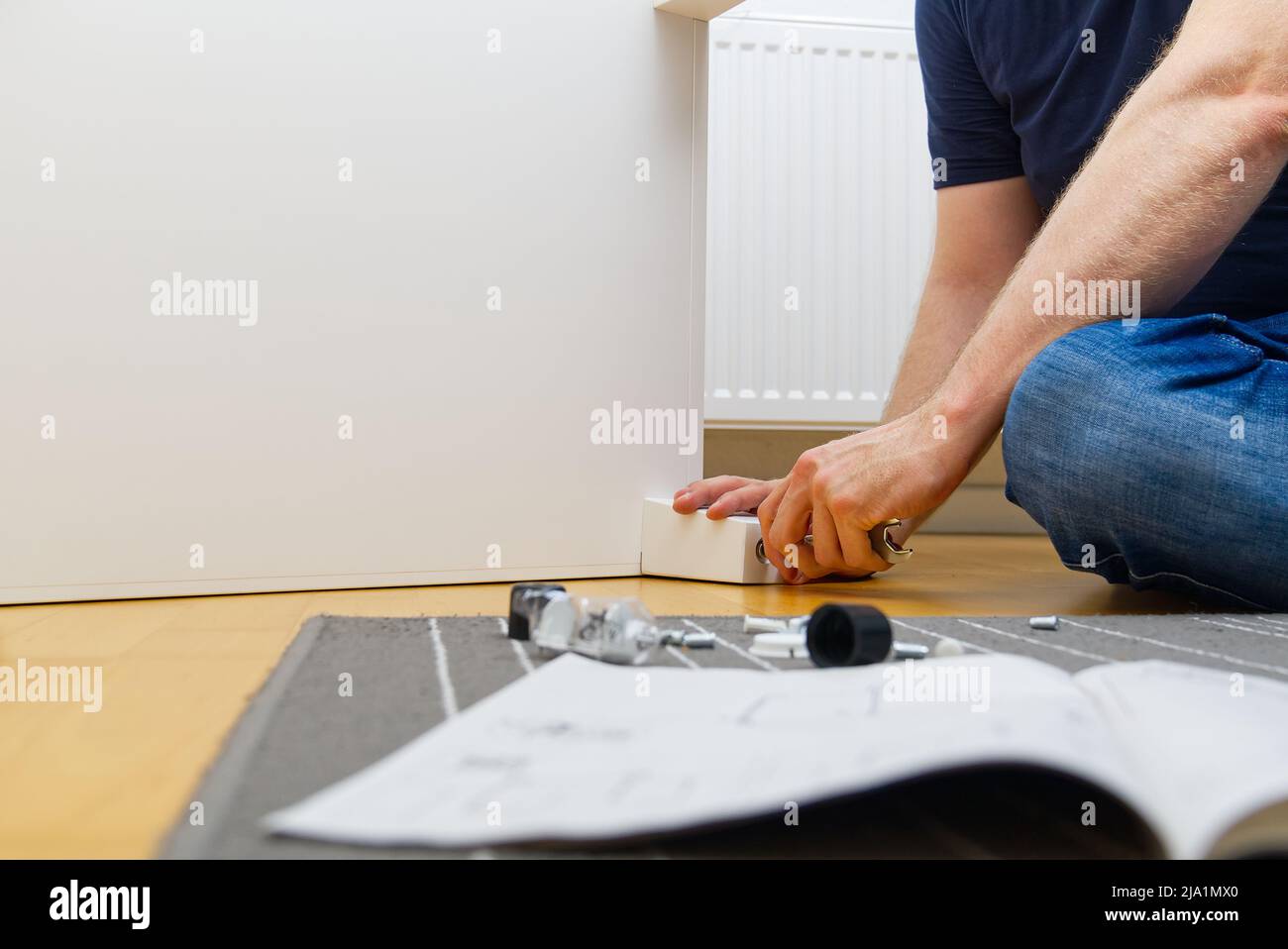 Carpentry Assembly Professional Furniture Assembly Worker Assembles Shelf. Furniture ...