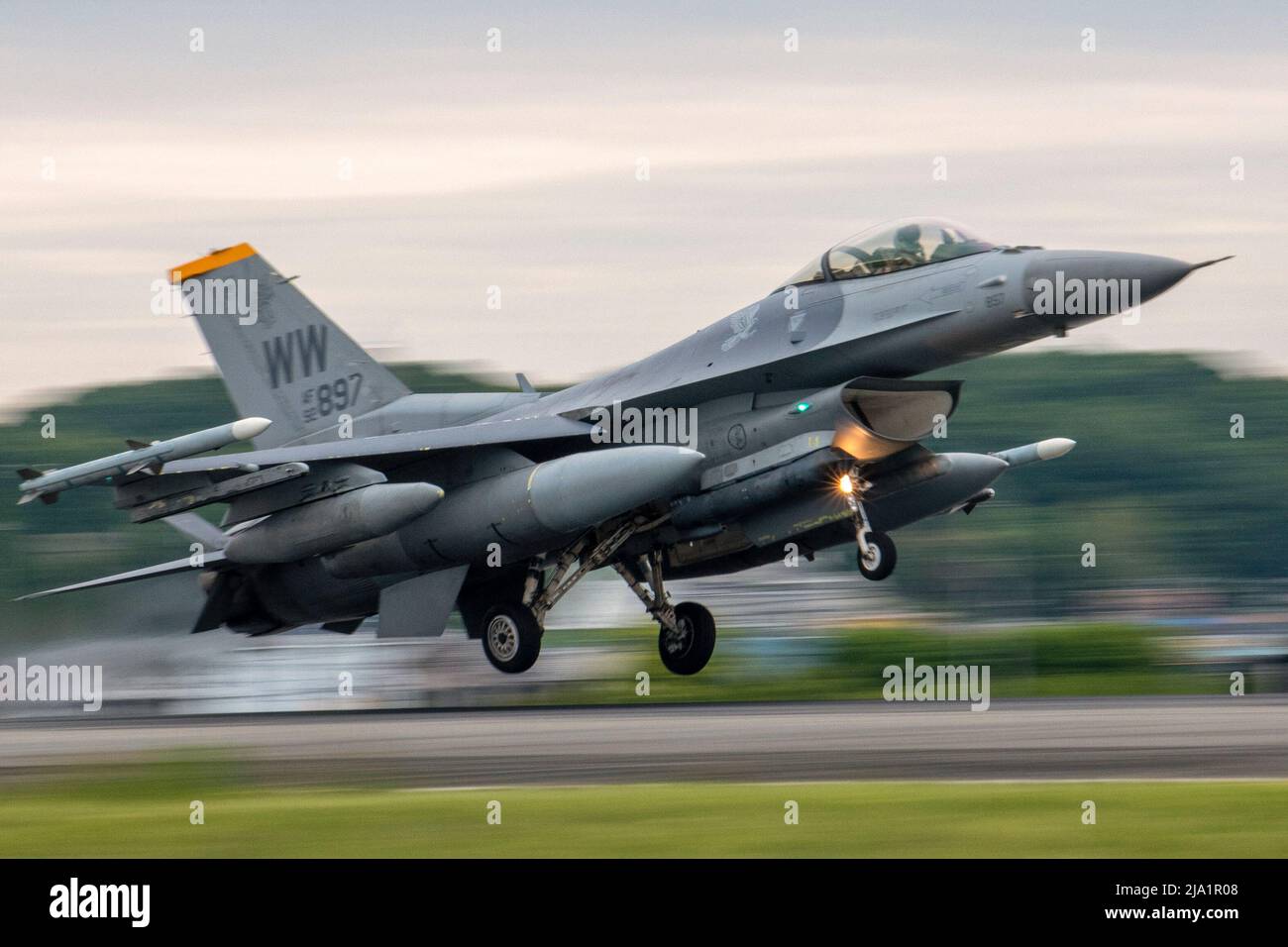 May 8, 2022 - Yokota Air Base, Japan - An F-16 Flighting Falcon assigned to the 14th Fighting Squadron, Misawa Air Base, Japan, lands at Yokota Air Base, Japan, to participate in a week-long Agile Combat Employment training exercise aimed at enhancing multi-capable Airmens skillset, May 8, 2022. Twelve 14th FS F-16s and crew members deployed to Yokota AB to participate in the exercise. Through ACE, the 35th Fighter Wing train alongside the 374th Airlift Wing to maintain a competitive edge over adversaries; and execute their mission to protect U.S. interests in the Pacific, defend Japan, and de Stock Photo