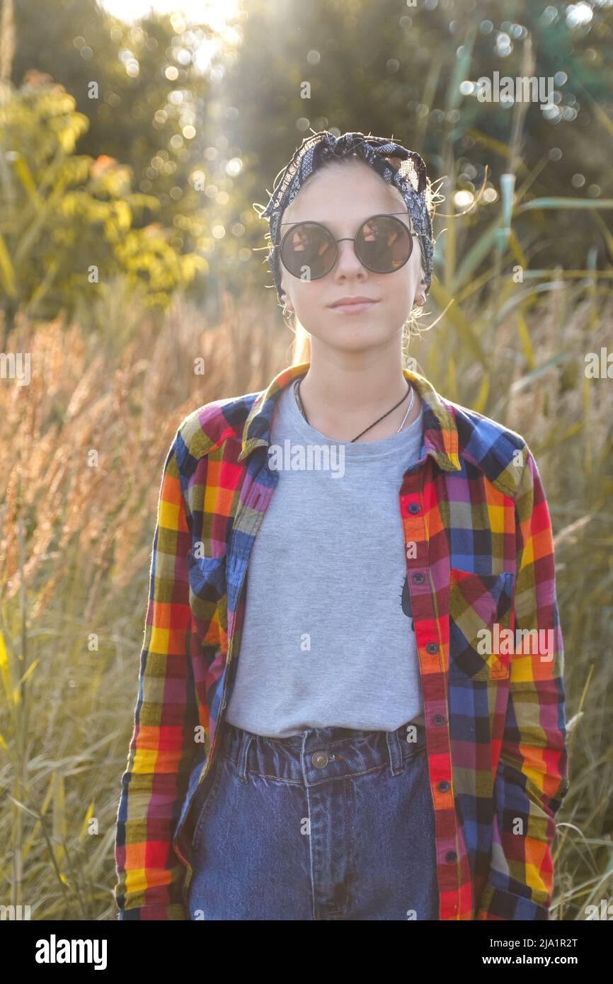 Defocus teen or preteen girl walking on nature background. Little kid ...