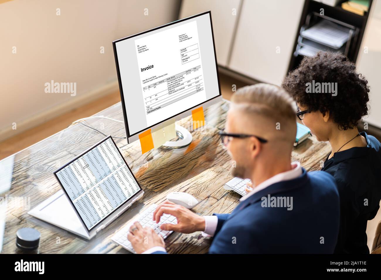 Analyst Working With Spreadsheet On Computer Screen Stock Photo