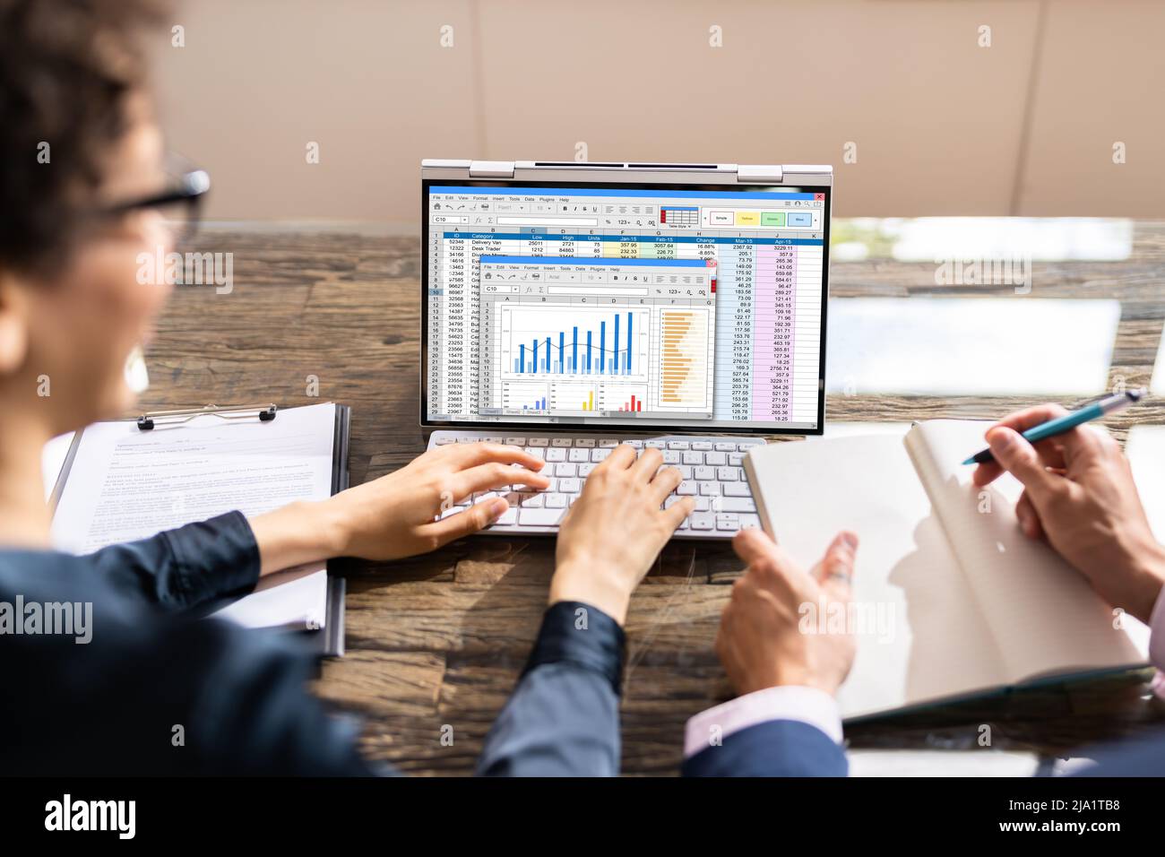Analyst Employee Working On Spreadsheet Using Desktop Computer Stock