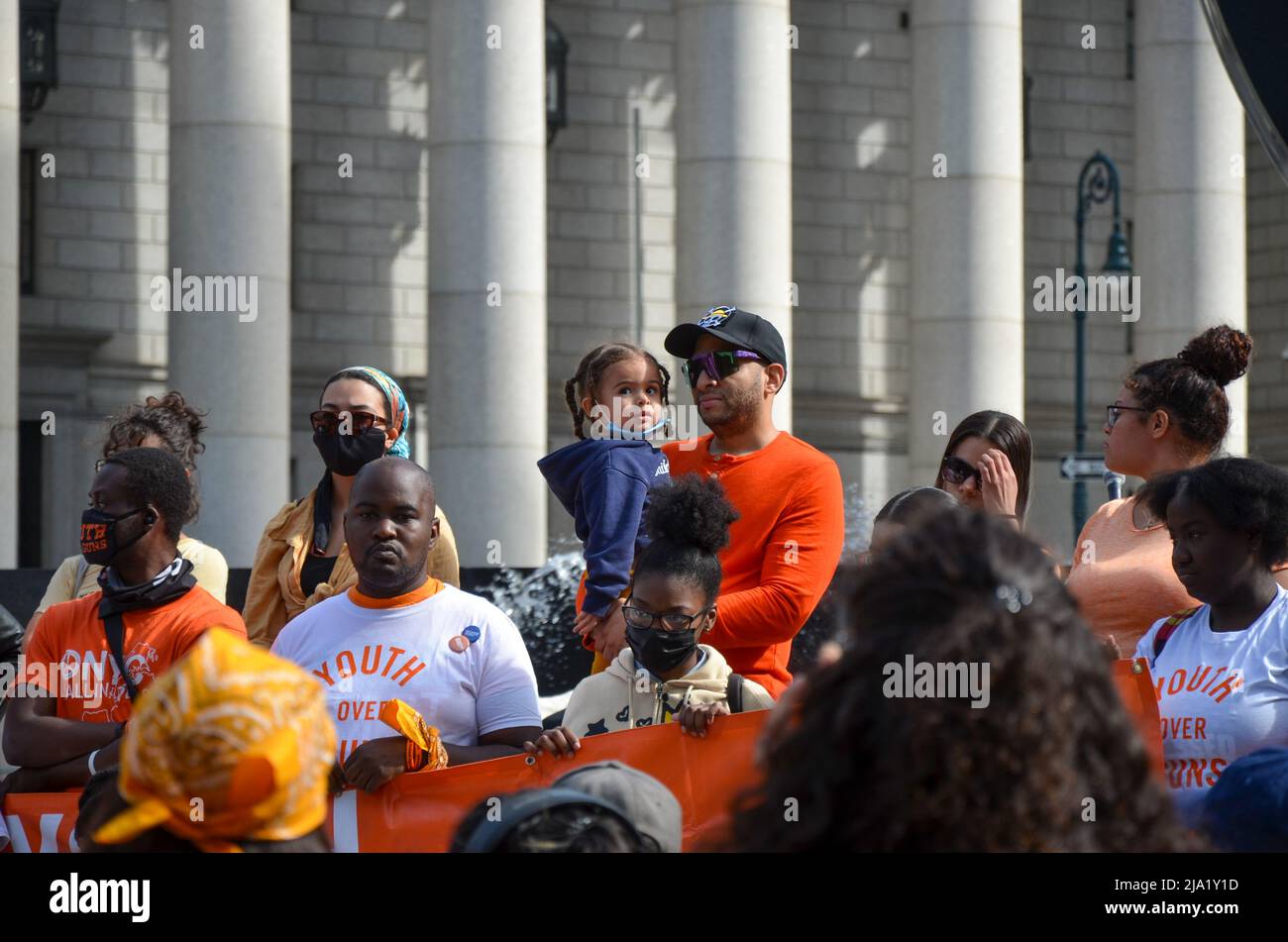 A young participant with her father at Foley Square in Lower Manhattan, New York City asking elected officials to take steps to prevent gun violence i Stock Photo