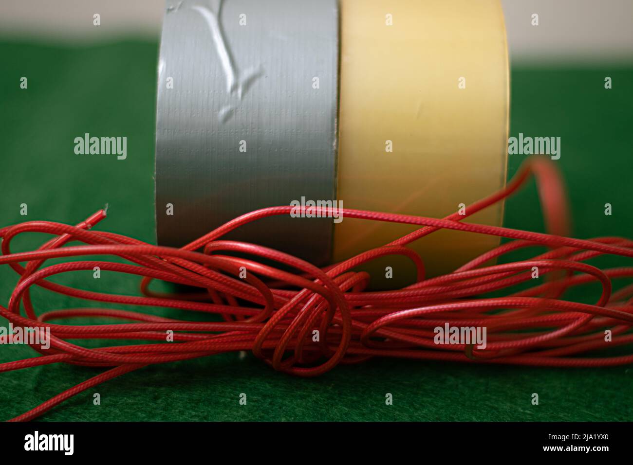 Different colored duct tapes and a red plastic string Stock Photo Alamy