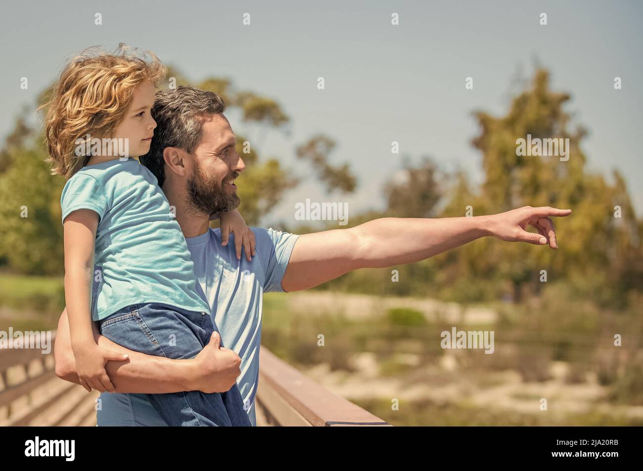 happy father holding son on hands outdoor. family value. childhood and parenthood. Stock Photo