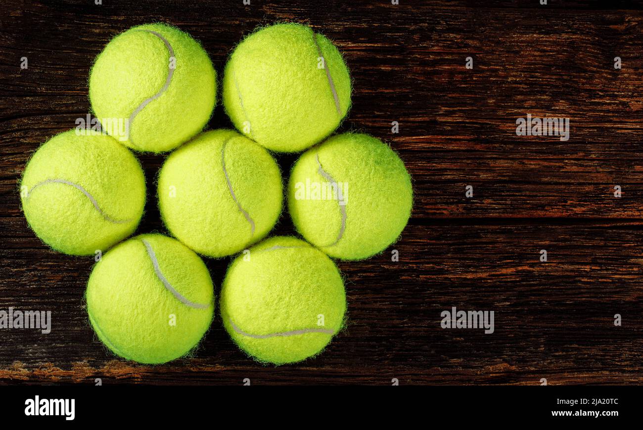 Tennis balls on wooden background, space for text, sport and competition concept Stock Photo