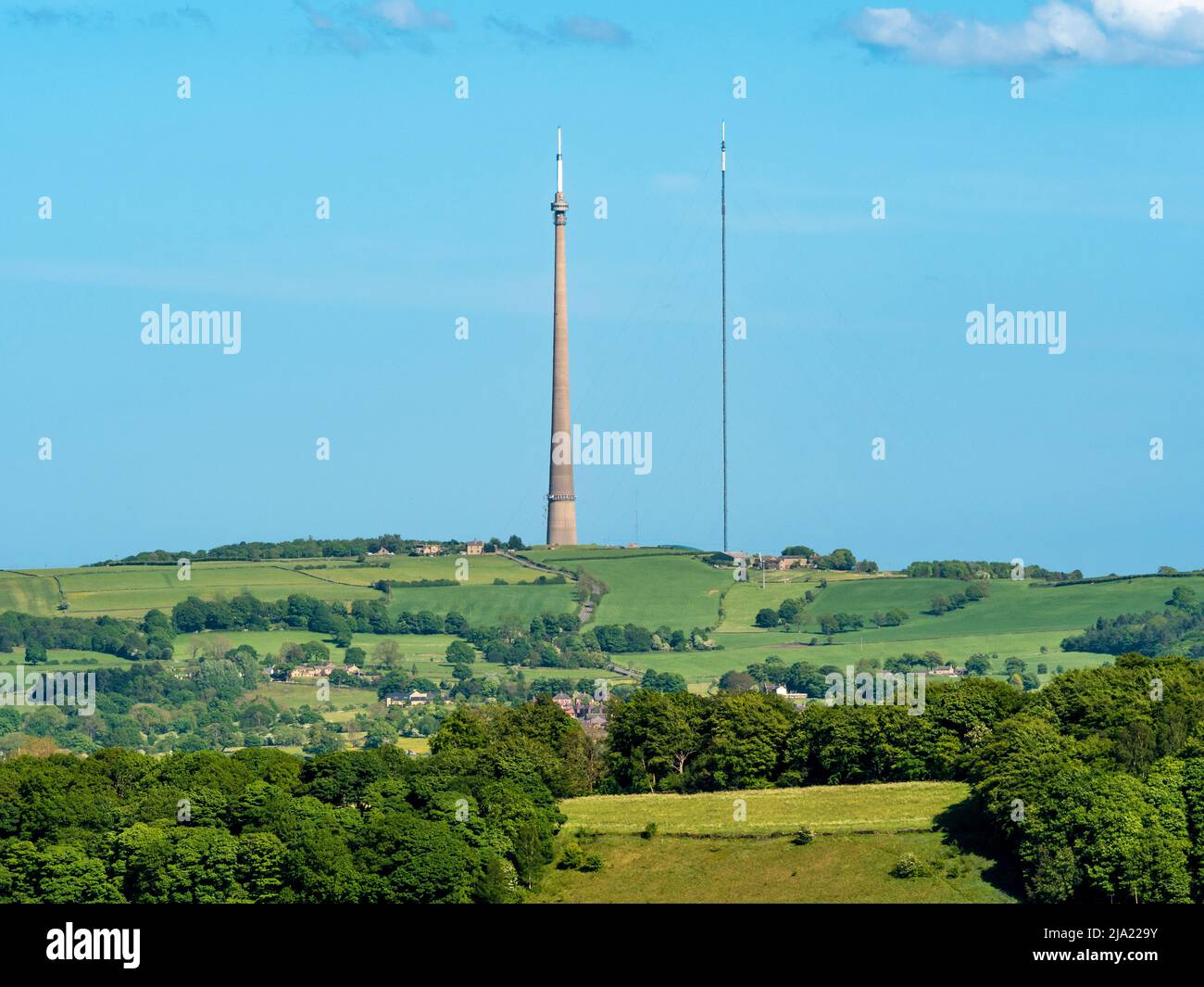 Emley Moor transmitter, grade II listed concrete tower, (currently undergoing repairs), with a second temporary mast to the right. Huddersfield. UK. Stock Photo