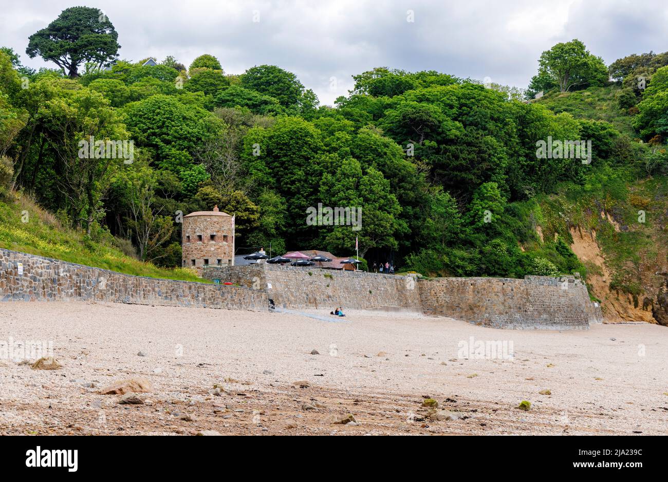 Fermain Tower no. 15, a defensive loophole tower by the Beach Cafe in Fermain Bay near St Peter Port, east coast of Guernsey, Channel Islands, UK Stock Photo