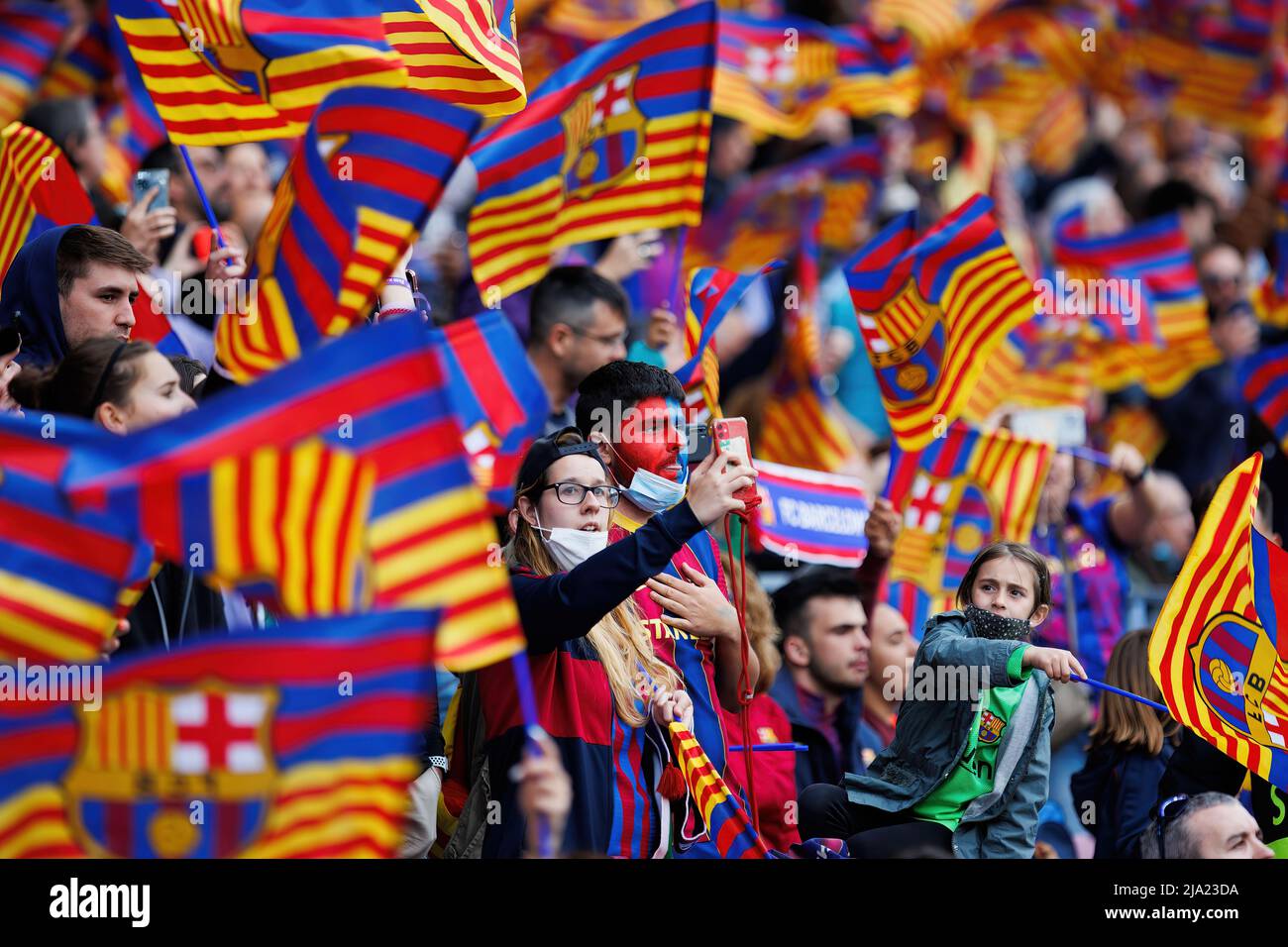 BARCELONA - APR 22: Fans waving flags during the UEFA Women's Champions League match between FC Barcelona and VfL Wolfsburg at the Camp Nou Stadium on Stock Photo