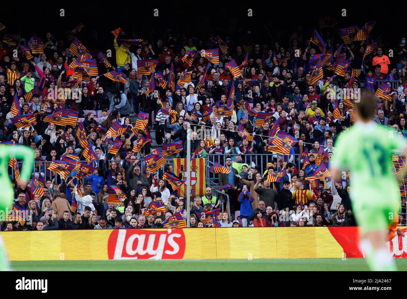 BARCELONA - APR 22: Fans cheering from the stands during the UEFA Women's Champions League match between FC Barcelona and VfL Wolfsburg at the Camp No Stock Photo