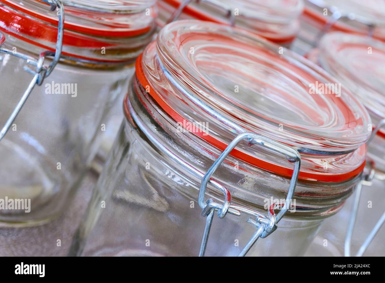Closeup of empty glass canning jars or preserving containers with