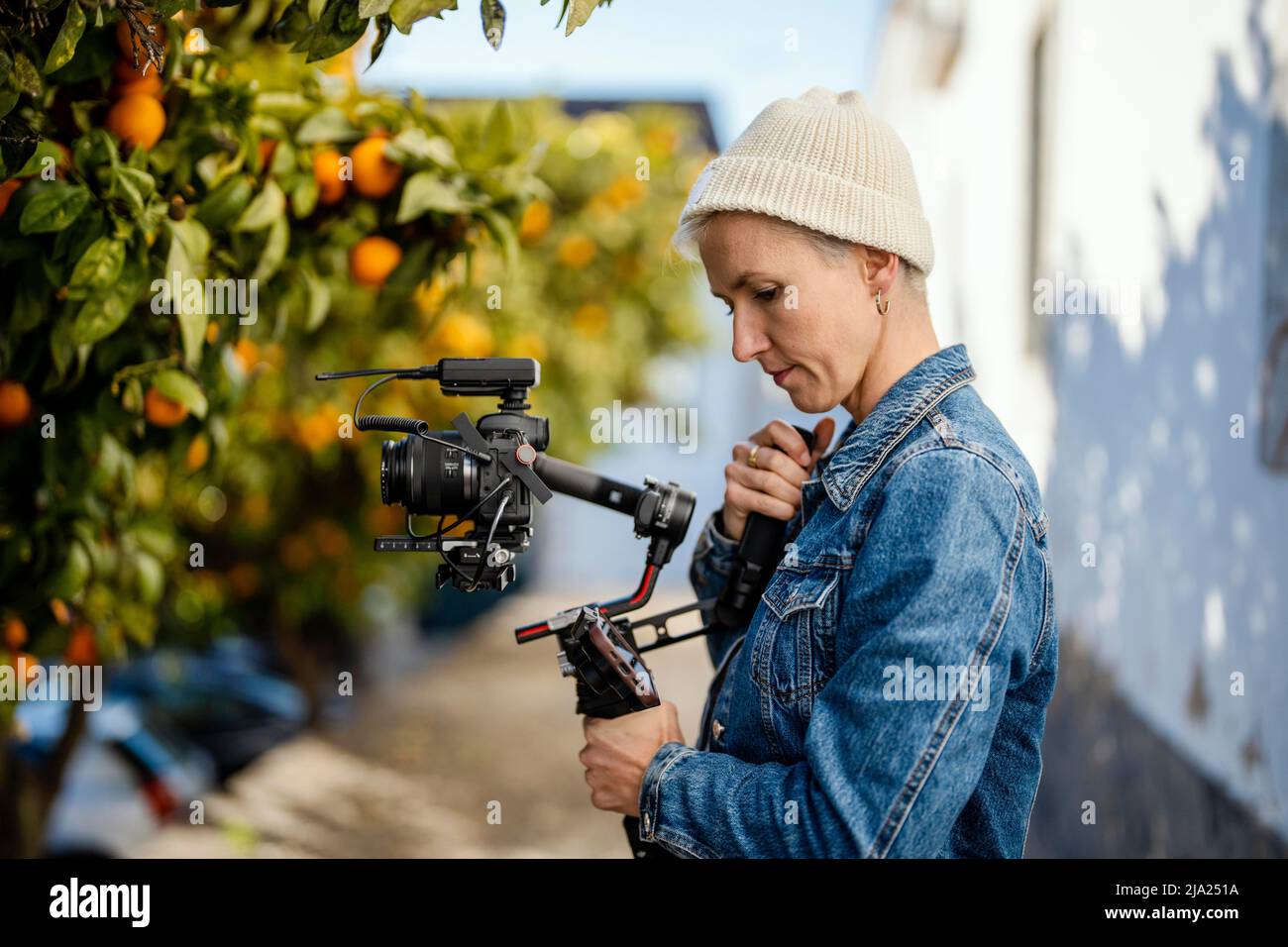 Camera operator with movie setup including a gimbal, video transmitter