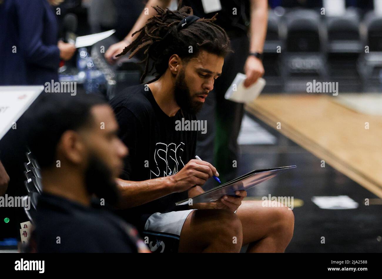 rapper-j-cole-prepares-ahead-of-his-first-game-with-the-toronto-area-cebl-canadian-elite-basketball-league-basketball-team-scarborough-shooting-stars-as-they-begin-their-season-against-the-guelph-nighthawks-in-guelph-ontario-canada-may-26-2022-reuterscarlos-osorio-2JA2588.jpg