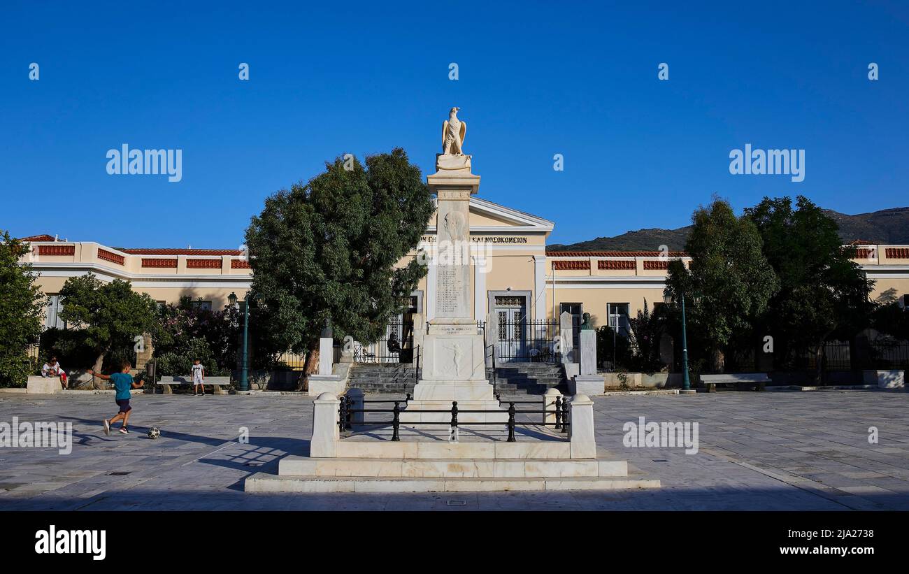 Monument, Chora, Andros town, blue cloudless sky, Andros island, Cyclades, Greece Stock Photo
