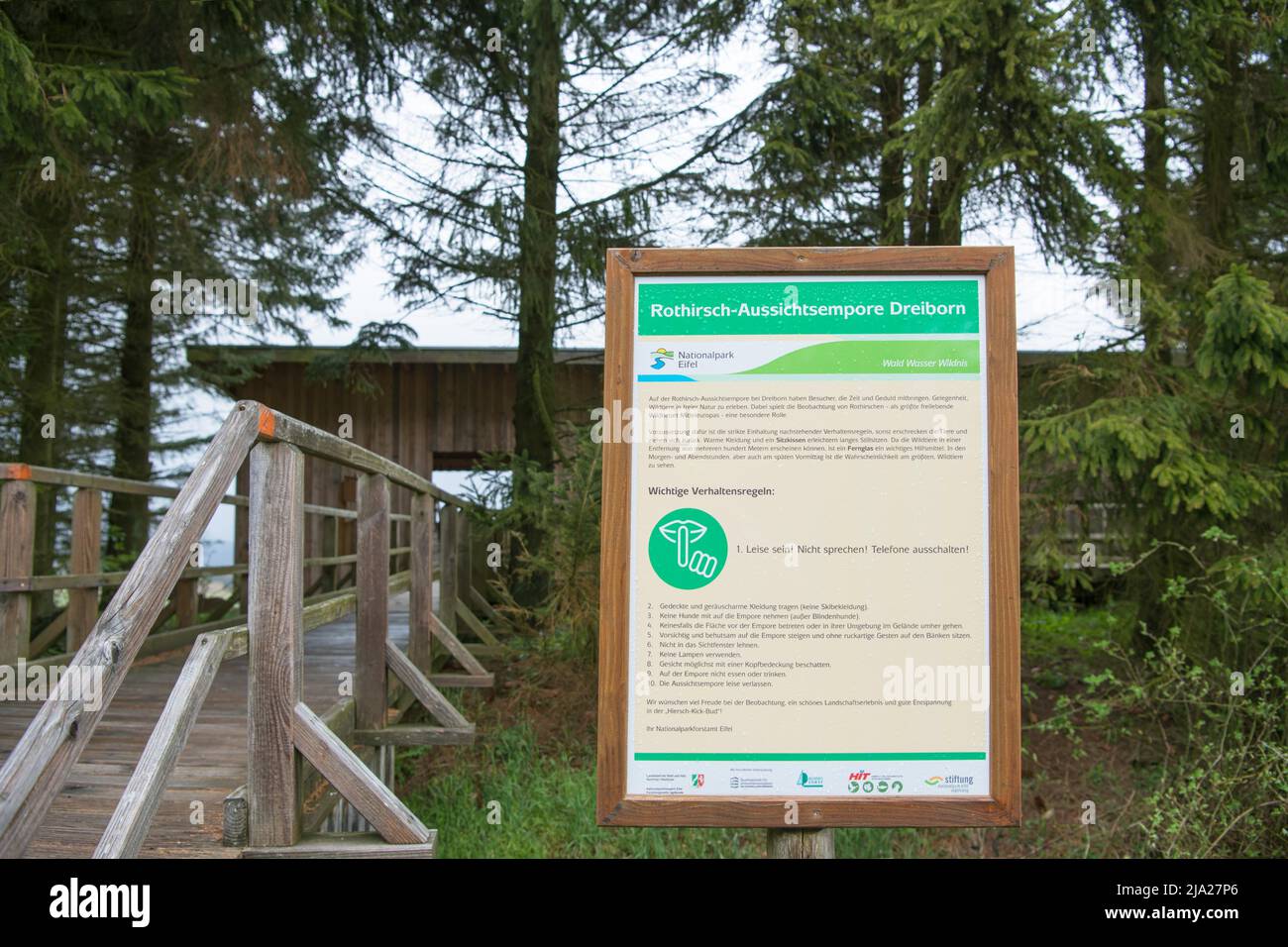 Red deer observation hut Dreiborner Hochflaeche, information board with rules of conduct, Eifel National Park, North Rhine-Westphalia, Germany Stock Photo