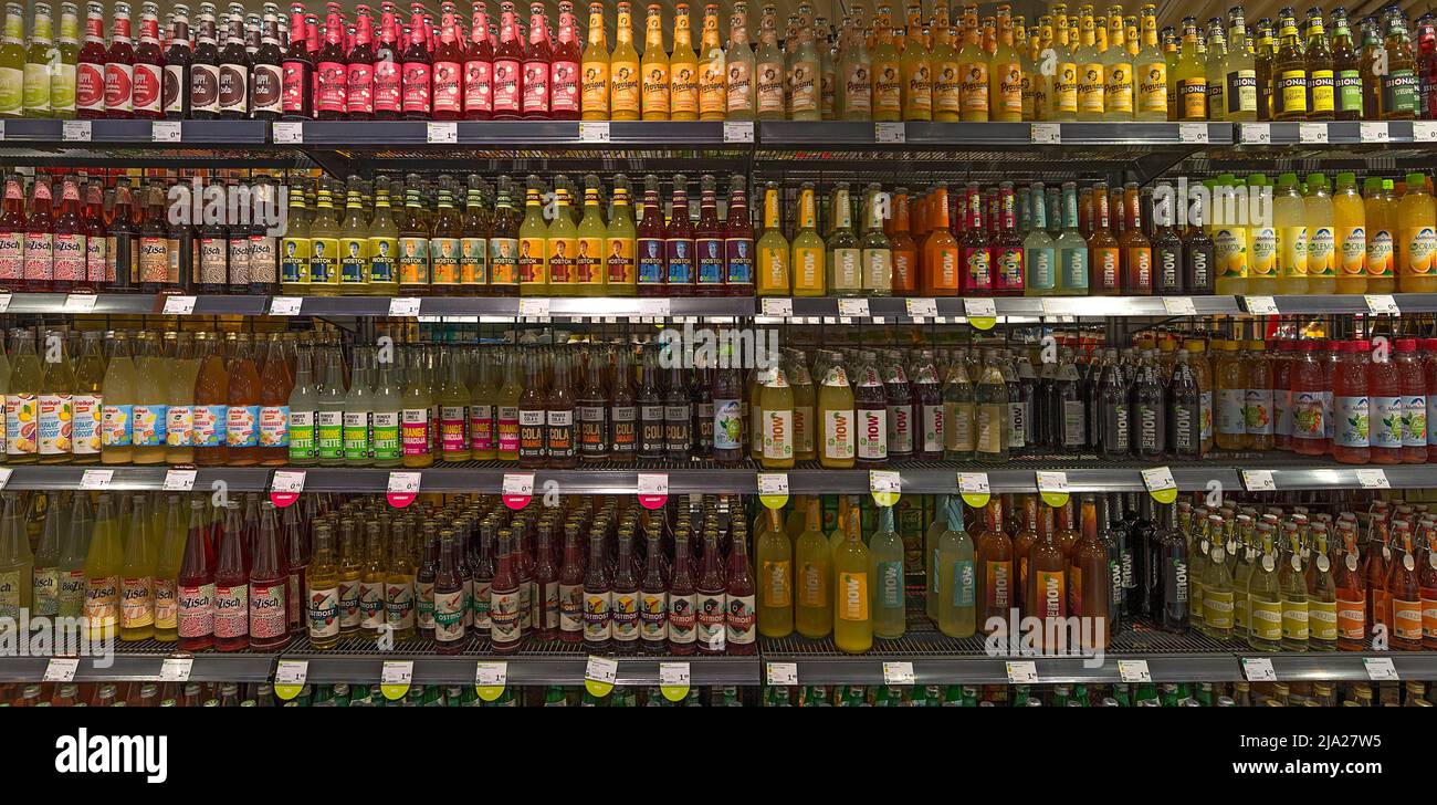 Shelves with nonalcoholic drinks in an organic supermarket, Lower