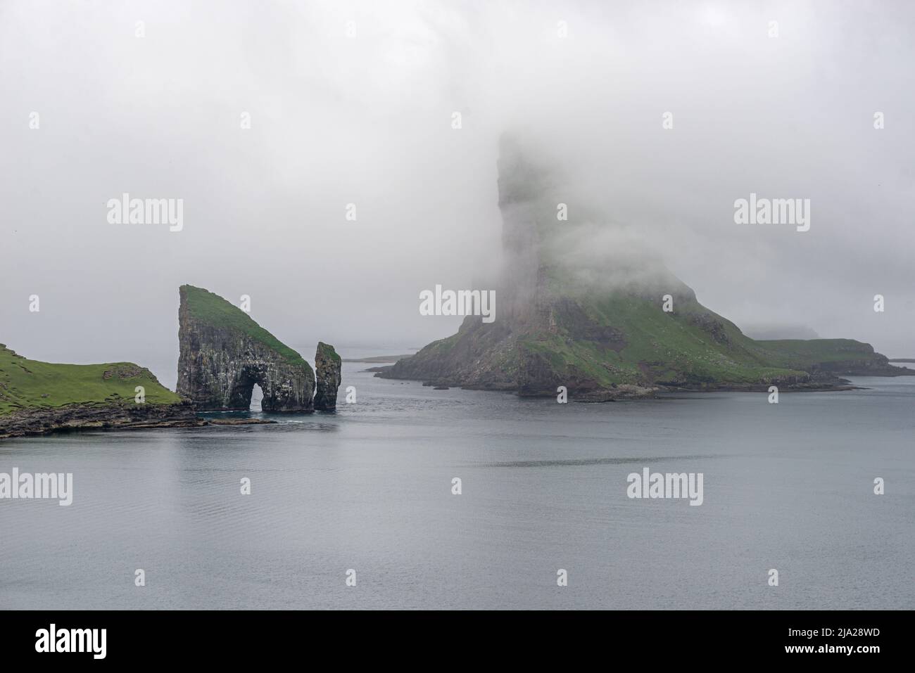Drangarnir in the mist, Vagar, Faroe Islands Stock Photo - Alamy