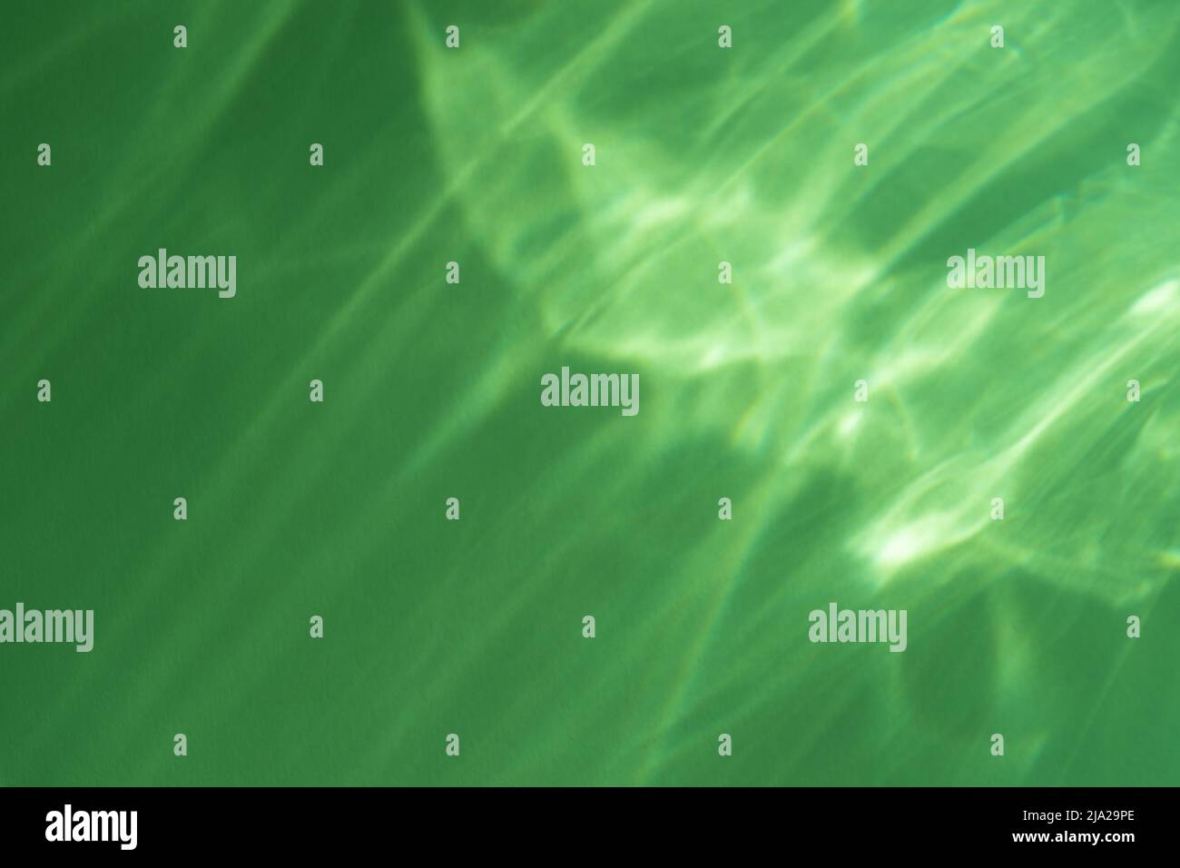 Caustic effect light refraction on green wall overlay photo mockup
