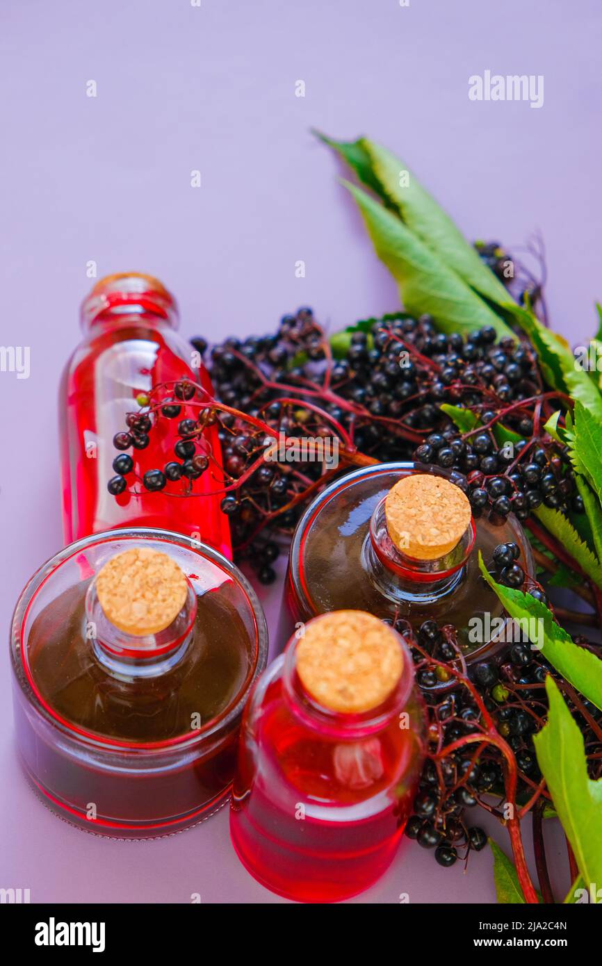 Elderberry syrup.Sambucus syrup.Elderberry branches. syrup in a bottle
