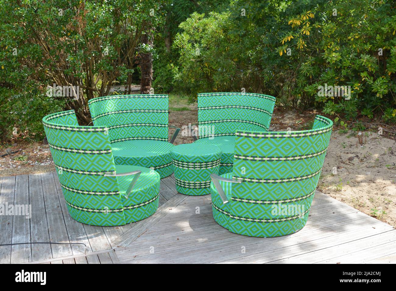 green wicker chairs and table in a restaurant Stock Photo - Alamy