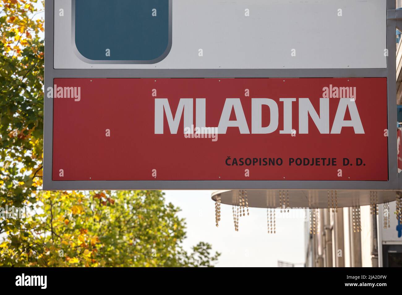 Picture of a sign with the logo of Mladina magazine in Ljubljana, Slovenia. Mladina is a Slovenian weekly left-wing political and current affairs maga Stock Photo