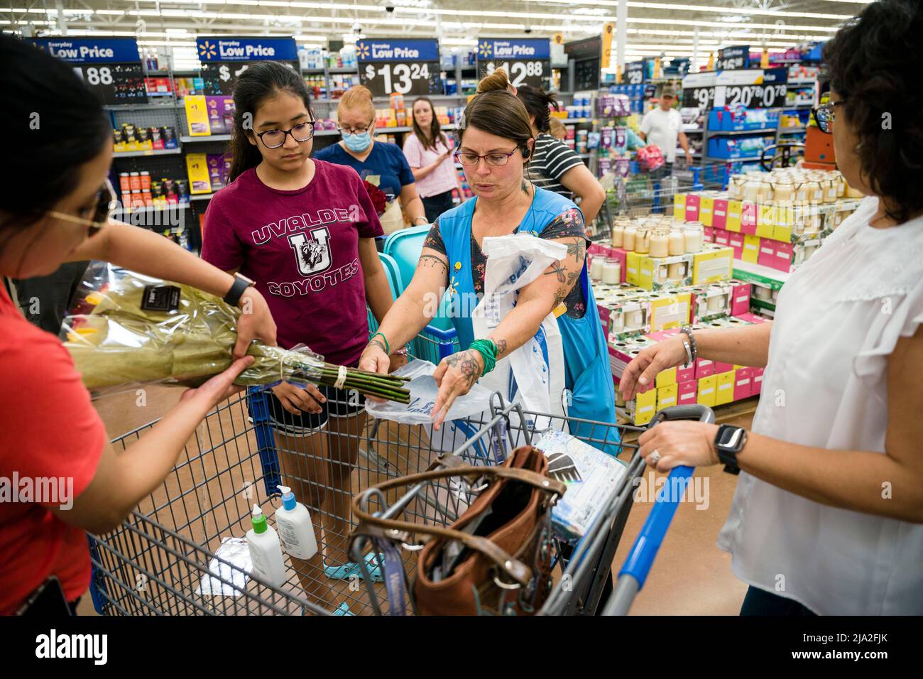 Uvalde, Texas, USA. 26th May, 2022. Guests pick out free flower