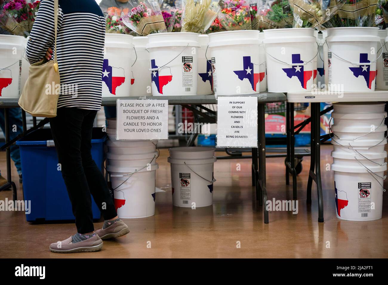 Uvalde, Texas, USA. 26th May, 2022. Guests pick out free flower bouquets at a Walmart in Uvalde