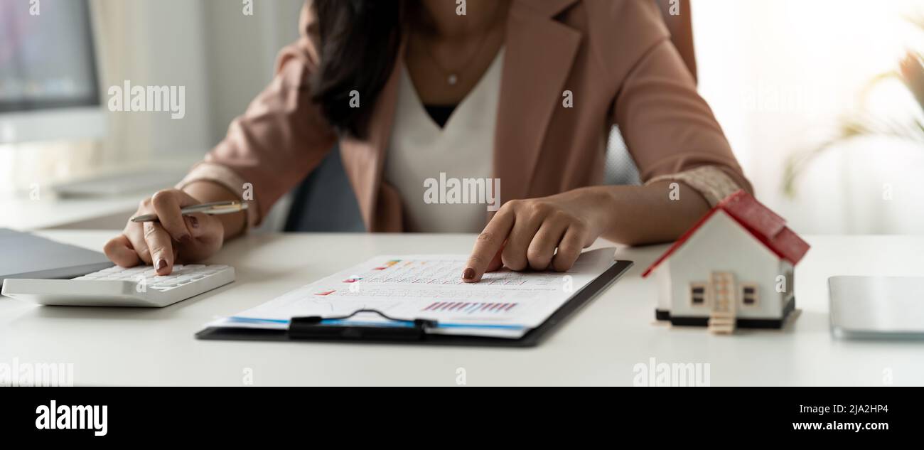 Businesswoman, financial accountants, planners, work, planning, ideas in the office, using the tools and calculators to work Stock Photo